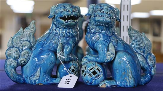 A pair of turquoise ground Buddhistic lions